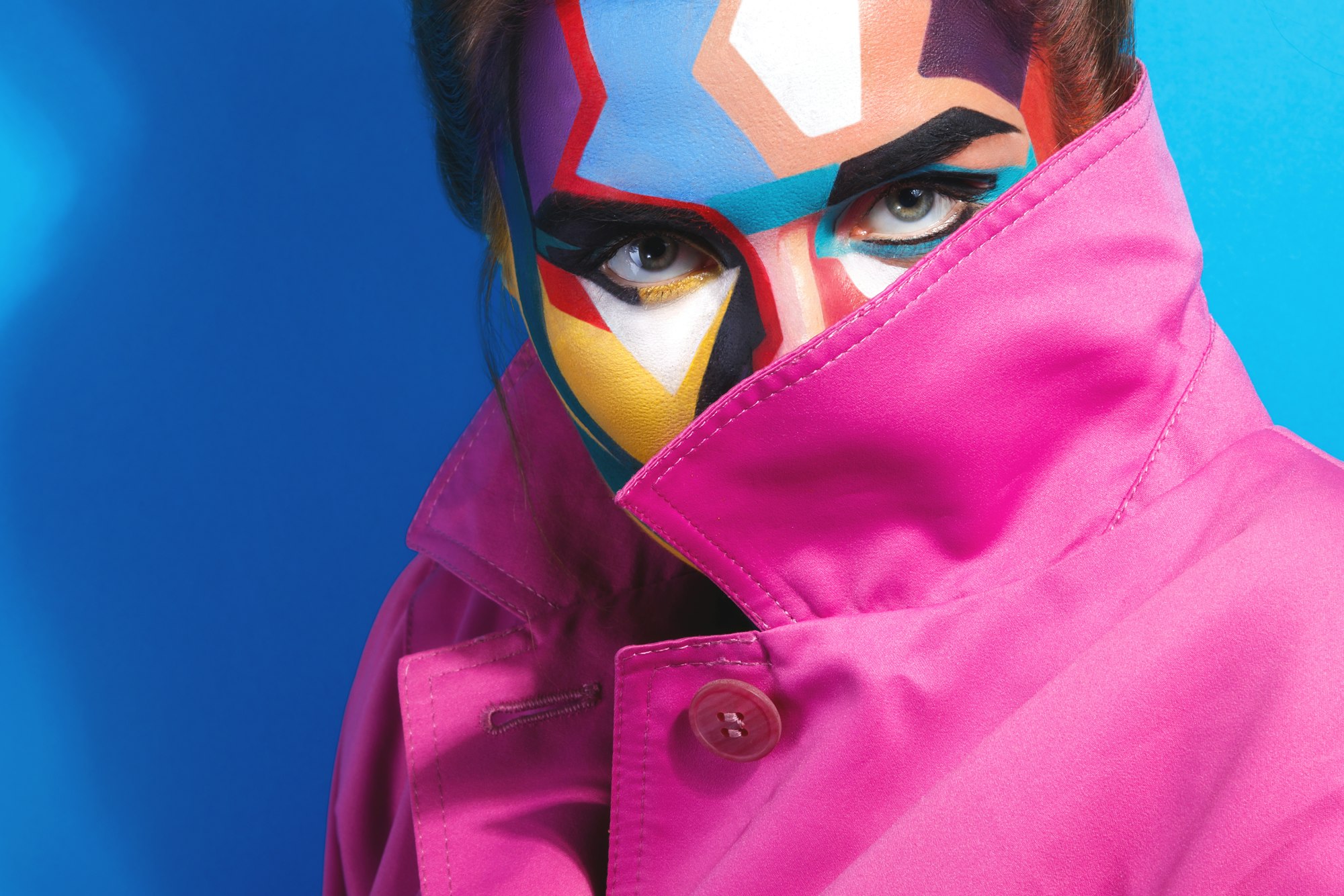 Model with a creative pop art make-up on her face